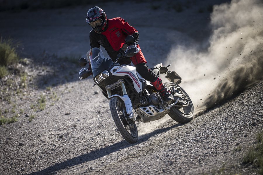 Ducati DesertX sliding through gravel